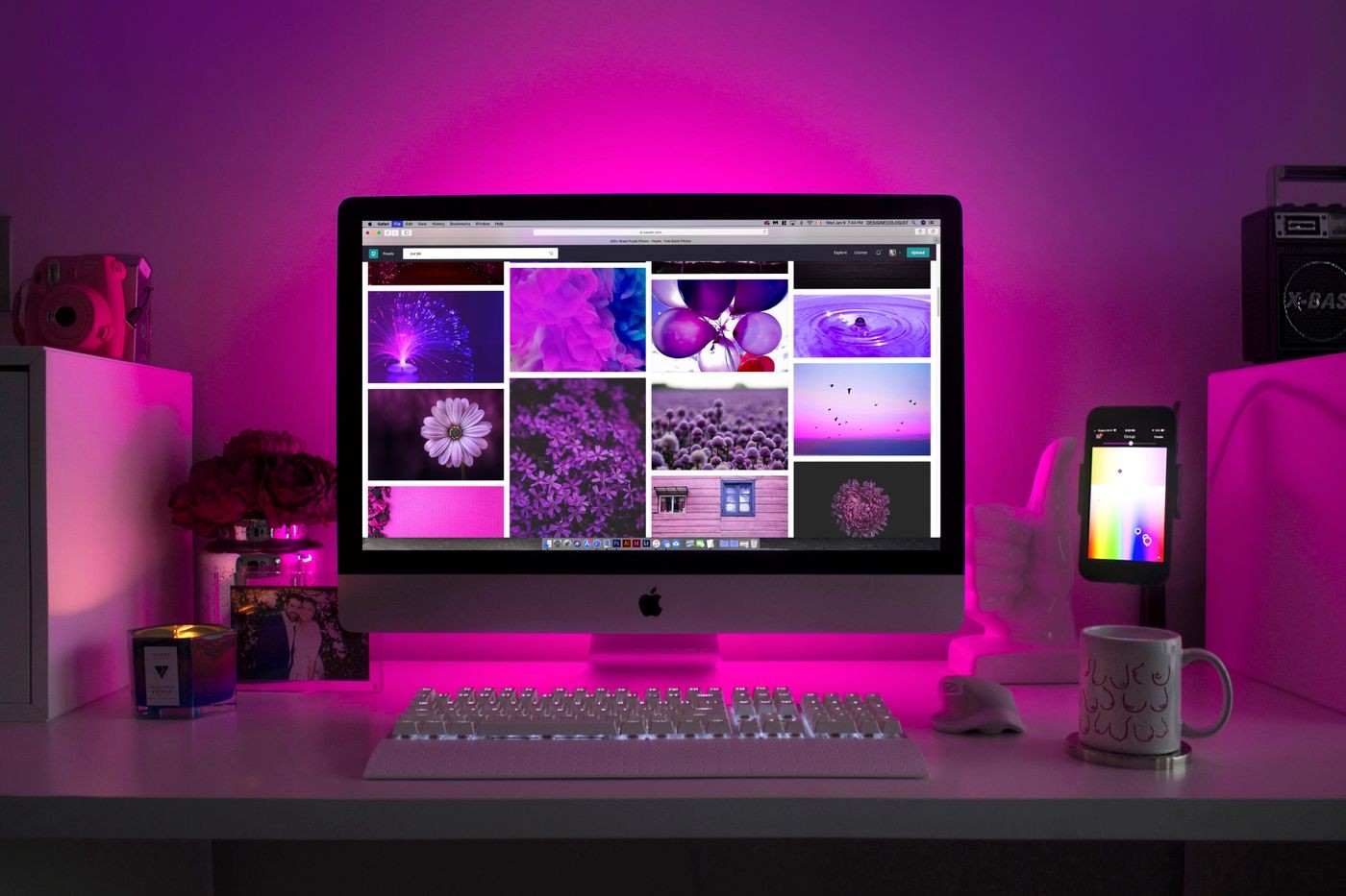 Creative studio desk with a digital moodboard on screen