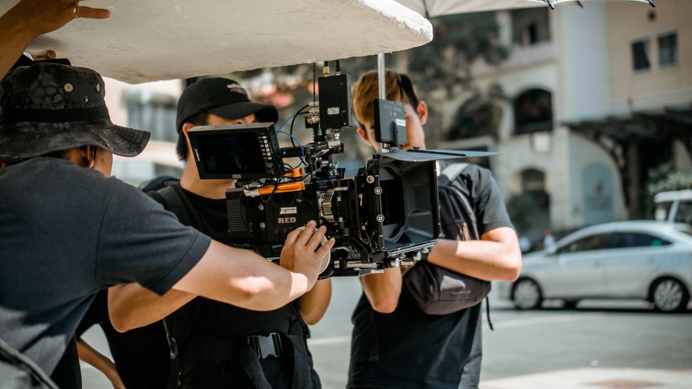 On-location film crew shooting with a cinema camera
