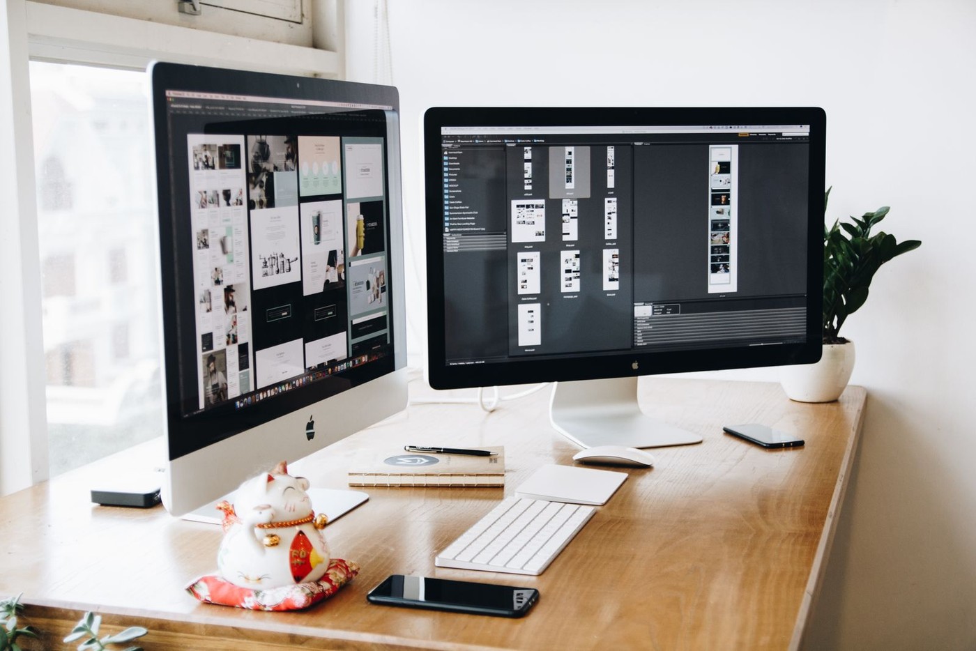 Website and interface design on dual studio monitors